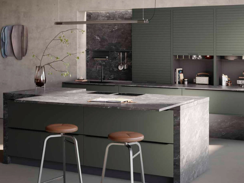 Luxury modern kitchen design with glass-front cabinetry, dark stone benchtops and minimalist island with bar stools.