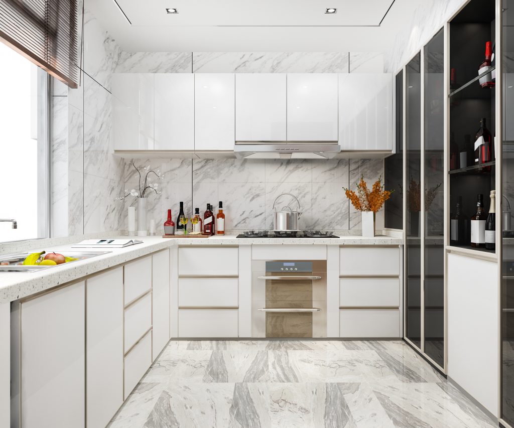a kitchen work triangle with white cabinets and marble floor